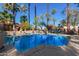 Sparkling community pool with palm trees and ample space for relaxation at 4540 N 44Th St # 69, Phoenix, AZ 85018