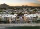 Aerial view of a condo community by a canal at 4805 N Woodmere Fairway Ln # 1012, Scottsdale, AZ 85251