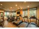 Modern gym with treadmills, ellipticals, and strength training equipment at 4805 N Woodmere Fairway Ln # 1012, Scottsdale, AZ 85251