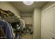 Large walk-in closet with ample shelving and hanging space at 4805 N Woodmere Fairway Ln # 1012, Scottsdale, AZ 85251