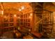 Impressive wine cellar with wooden racks and a spiral staircase at 4805 N Woodmere Fairway Ln # 1012, Scottsdale, AZ 85251