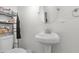 Small bathroom with a pedestal sink and toilet at 500 W Jasper Dr, Chandler, AZ 85225