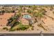 Community pool and spa surrounded by palm trees and homes at 5025 E Waltann Ln, Scottsdale, AZ 85254