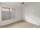 Small bedroom with a window and ceiling fan at 5025 E Waltann Ln, Scottsdale, AZ 85254