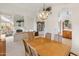 Bright dining room features a wood table with chairs, built-in shelving, and a view into the living room at 5025 E Waltann Ln, Scottsdale, AZ 85254