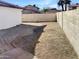 Small backyard with gravel and a paved patio area at 5036 W Gelding Dr, Glendale, AZ 85306