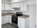 White kitchen cabinets and stainless steel appliances at 5036 W Gelding Dr, Glendale, AZ 85306