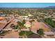 Aerial view of a house with a pool and large backyard, in a desert setting at 5271 E Shiprock St, Apache Junction, AZ 85119