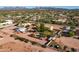 Aerial view of a house with a pool and detached workshop, large yard at 5271 E Shiprock St, Apache Junction, AZ 85119