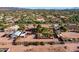 Aerial view of a house with a pool, large yard, and detached workshop at 5271 E Shiprock St, Apache Junction, AZ 85119