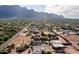 Aerial view of a house with mountain views and a large backyard at 5271 E Shiprock St, Apache Junction, AZ 85119