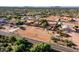 Aerial view of a house with a pool and large backyard, in a desert setting at 5271 E Shiprock St, Apache Junction, AZ 85119