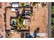 Aerial view of a house with a pool, large yard, and detached workshop at 5271 E Shiprock St, Apache Junction, AZ 85119