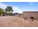 Tan colored barn with corral and riding area at 5271 E Shiprock St, Apache Junction, AZ 85119