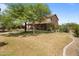 Two story house exterior with a large grassy yard at 5271 E Shiprock St, Apache Junction, AZ 85119