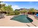 Freeform pool with a mountain backdrop at 5271 E Shiprock St, Apache Junction, AZ 85119