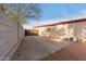 Backyard with concrete patio and block wall at 5715 W Heatherbrae Dr, Phoenix, AZ 85031