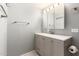 Bathroom with vanity, mirror, and gray cabinets at 5715 W Heatherbrae Dr, Phoenix, AZ 85031