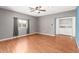 Bedroom with laminate wood floors and laundry area at 5715 W Heatherbrae Dr, Phoenix, AZ 85031