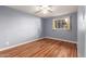 Bedroom with wood-look floors and a ceiling fan at 5715 W Heatherbrae Dr, Phoenix, AZ 85031