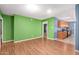 Dining area with laminate wood floors and kitchen access at 5715 W Heatherbrae Dr, Phoenix, AZ 85031