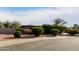 Neatly landscaped front yard with shrubs at 5715 W Heatherbrae Dr, Phoenix, AZ 85031