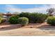 Landscaped front yard with bushes and gravel at 5715 W Heatherbrae Dr, Phoenix, AZ 85031