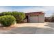 Attached garage with driveway and landscaping at 5715 W Heatherbrae Dr, Phoenix, AZ 85031