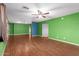 Living room with laminate wood floors and green walls at 5715 W Heatherbrae Dr, Phoenix, AZ 85031