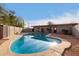 Inviting kidney-shaped pool with a large backyard at 5715 W Heatherbrae Dr, Phoenix, AZ 85031