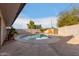 Inviting kidney-shaped pool in the backyard at 5715 W Heatherbrae Dr, Phoenix, AZ 85031