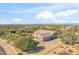 Aerial view of single-story house with a large backyard and desert landscaping at 5950 E Lowden Ct, Cave Creek, AZ 85331