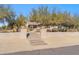 Front yard view of a single-story house with desert landscaping and walkway at 5950 E Lowden Ct, Cave Creek, AZ 85331