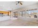 Living room with ceiling fan, neutral carpet, and large windows at 5950 E Lowden Ct, Cave Creek, AZ 85331