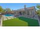 Inviting backyard with a pool, patio furniture, and a view of the house at 6406 E Helm Dr, Scottsdale, AZ 85254