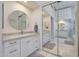 Spacious bathroom with dual sinks, a large mirror, and ample storage at 6406 E Helm Dr, Scottsdale, AZ 85254