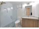 Modern bathroom with a walk-in shower and vanity at 6406 E Helm Dr, Scottsdale, AZ 85254