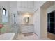 Bathroom with a walk-in shower, white vanity, and marble tile at 6406 E Helm Dr, Scottsdale, AZ 85254