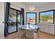 Bright dining area with a round table and chairs, overlooking the backyard at 6406 E Helm Dr, Scottsdale, AZ 85254