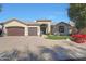 Single-story home with two-car garage and landscaped front yard at 6406 E Helm Dr, Scottsdale, AZ 85254