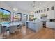 Modern kitchen with white cabinets and large island at 6406 E Helm Dr, Scottsdale, AZ 85254