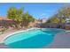 Inviting kidney shaped pool with landscaping at 6406 E Helm Dr, Scottsdale, AZ 85254