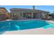 Stunning kidney-shaped pool with plenty of space for relaxation at 6406 E Helm Dr, Scottsdale, AZ 85254