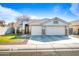 Two-story house exterior with a two-car garage and well-maintained lawn at 731 N Nantucket St, Chandler, AZ 85225