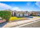 House exterior with a two-car garage and lush green landscaping at 731 N Nantucket St, Chandler, AZ 85225