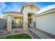 House exterior featuring a covered porch and stone accents at 731 N Nantucket St, Chandler, AZ 85225