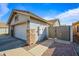 Attached garage with stone accents and a side gate at 731 N Nantucket St, Chandler, AZ 85225