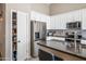 Spacious kitchen with stainless steel appliances and pantry at 731 N Nantucket St, Chandler, AZ 85225