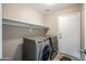 Laundry room with washer, dryer, and shelving at 731 N Nantucket St, Chandler, AZ 85225