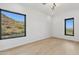 Light bedroom with mountain views and hardwood floors at 8200 N Charles Dr, Paradise Valley, AZ 85253